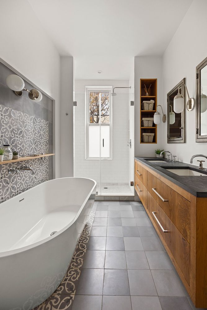 a spacious bathroom with a granite countertop tub sink and mirror