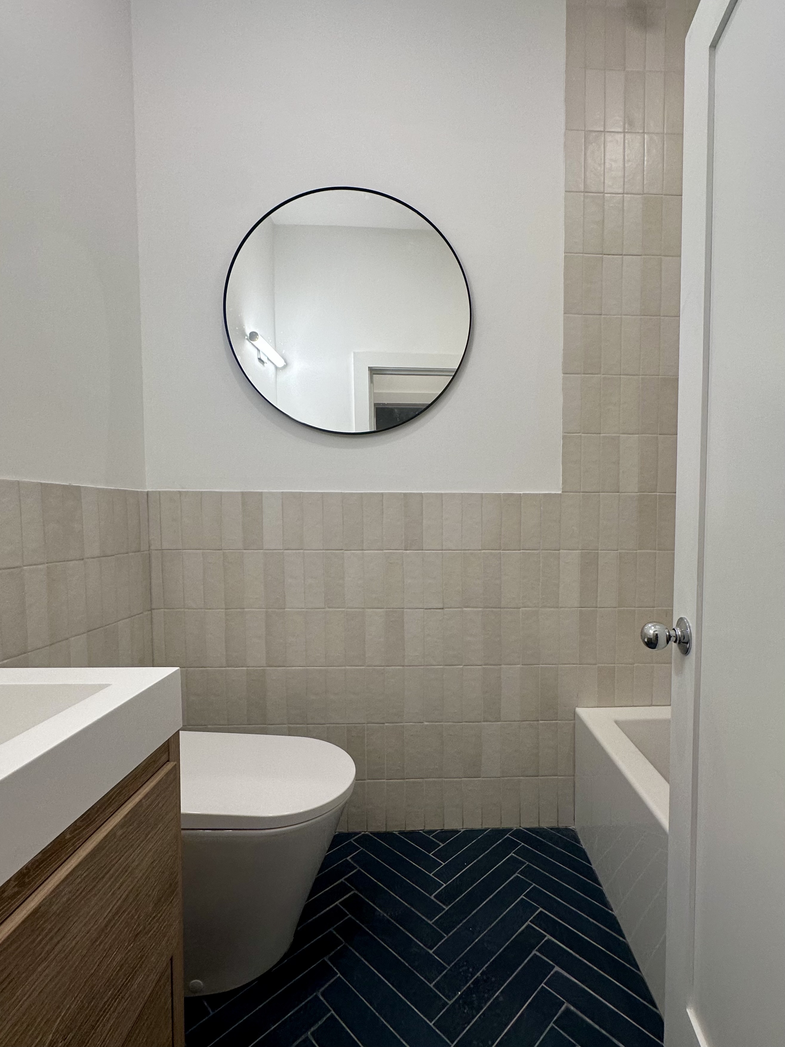 129 Malcolm X Boulevard, Unit 3 Brooklyn, NY 11221 - Photo 9 of 26 a bathroom with a sink and a mirror