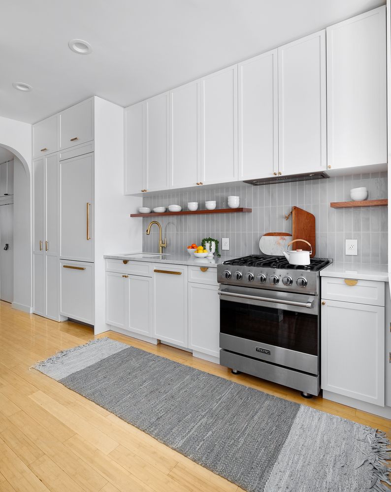 258 West 93rd Street, Unit 4AB Manhattan, NY 10025 - Photo 3 of 10 a kitchen with a stove and white cabinets