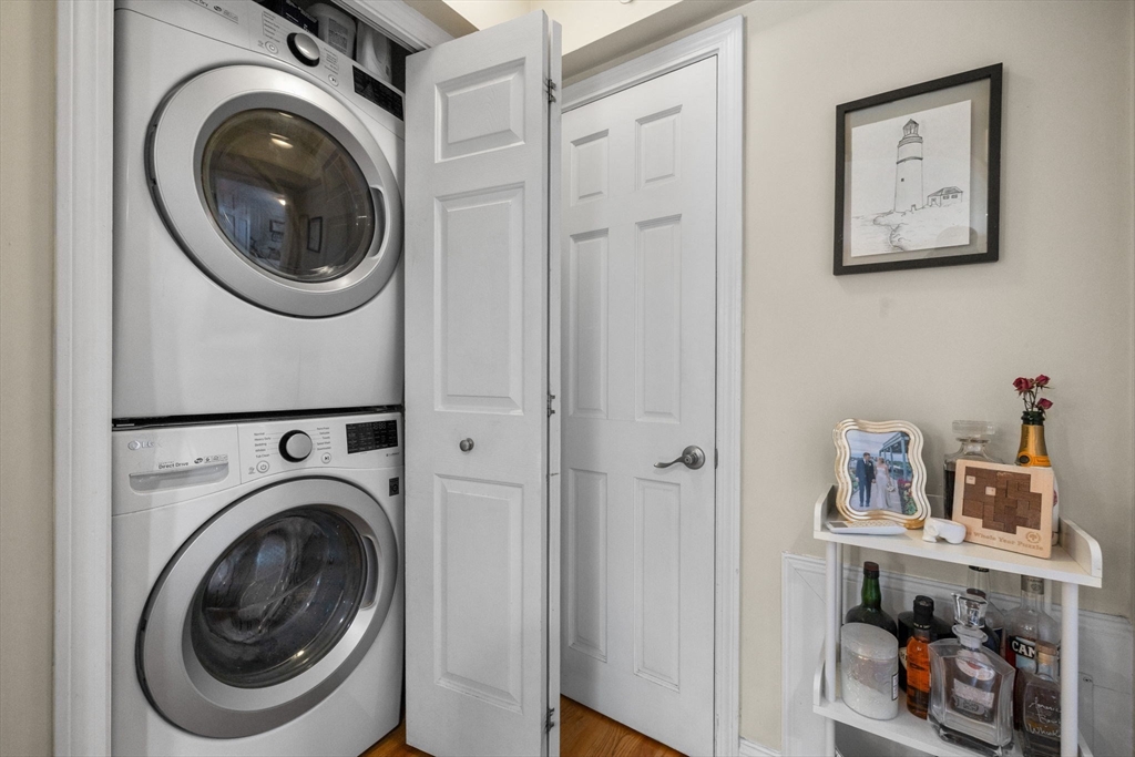 27-29 Commonwealth Avenue, Unit 9 Newton, MA 02467 - Photo 12 of 20 a utility room with dryer and washer