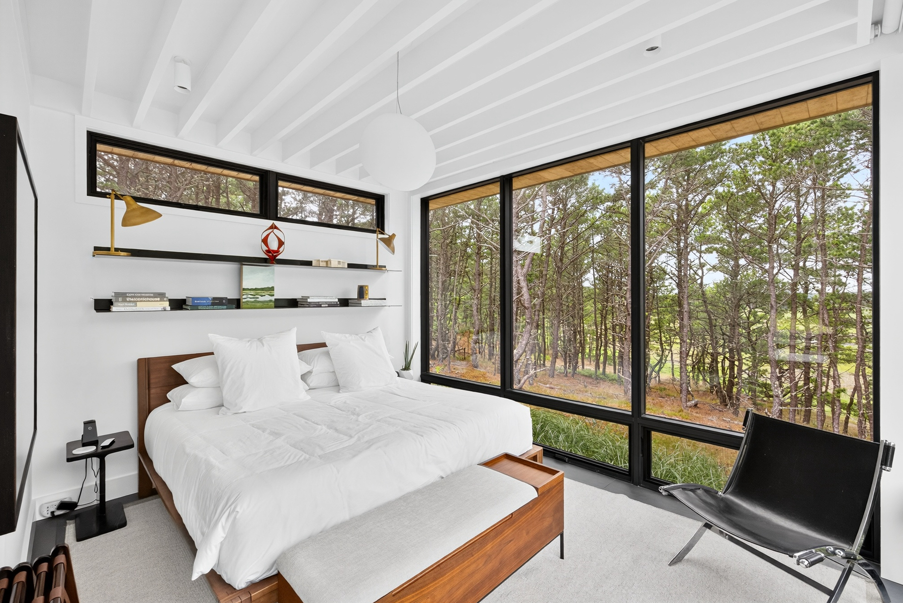 375 King Phillip Road Wellfleet, MA 02667 - Photo 24 of 27 a large bedroom with a bed and large window