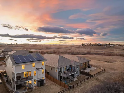 an aerial view of a house with roof deck