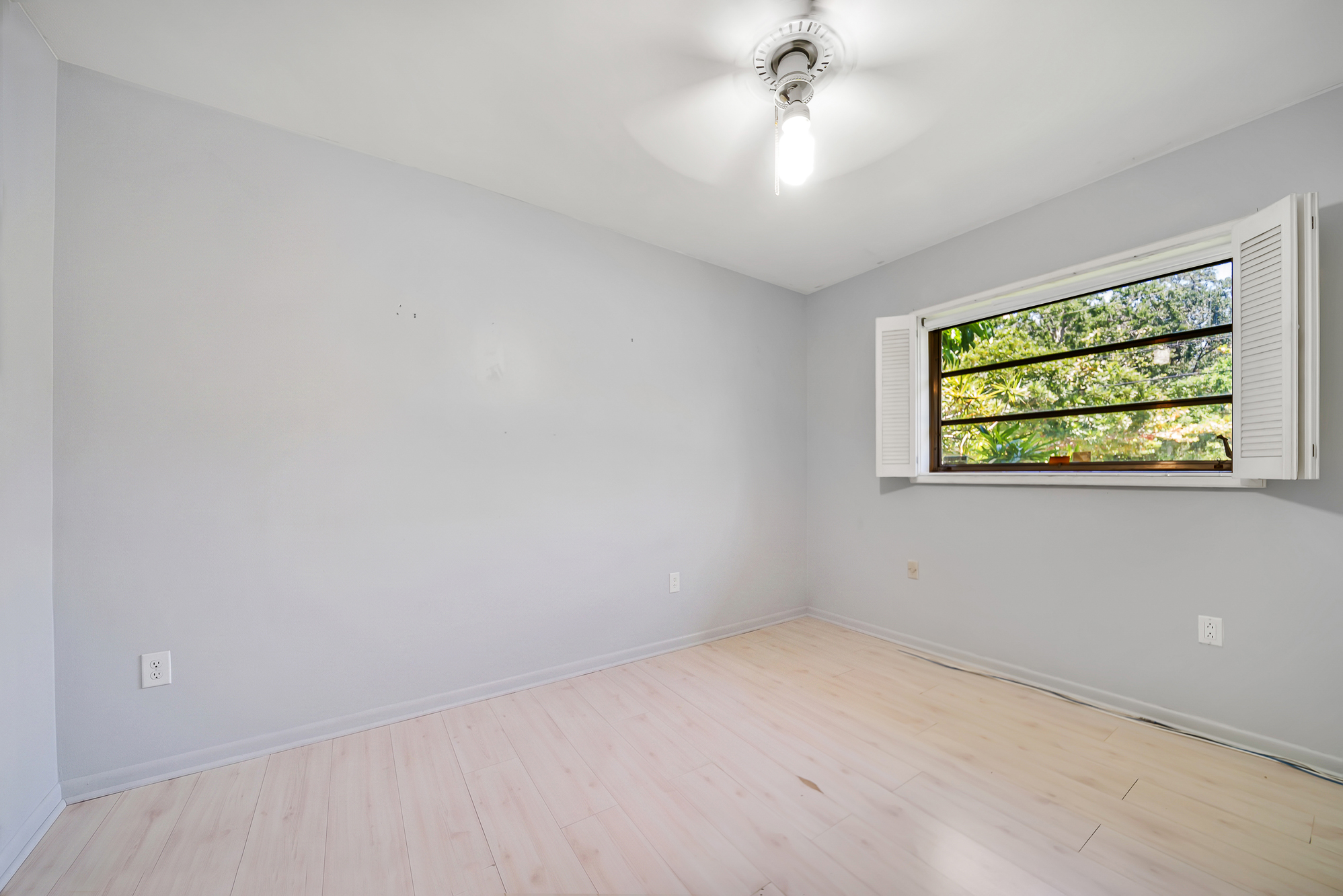 6760 Southwest 62nd Terrace Miami, FL 33143 - Photo 14 of 38 wooden floor in an empty room with a window
