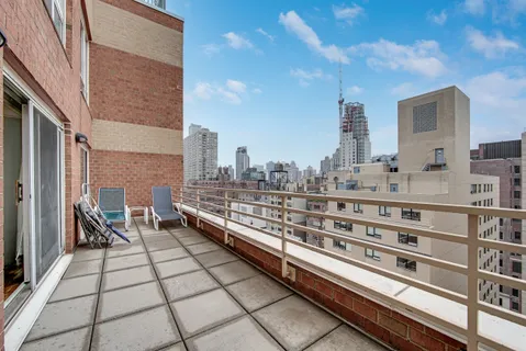 a view of a balcony with chairs