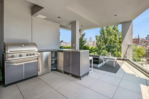a kitchen with a stove and a refrigerator