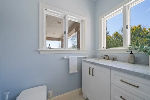 a view of a house with wooden fence
