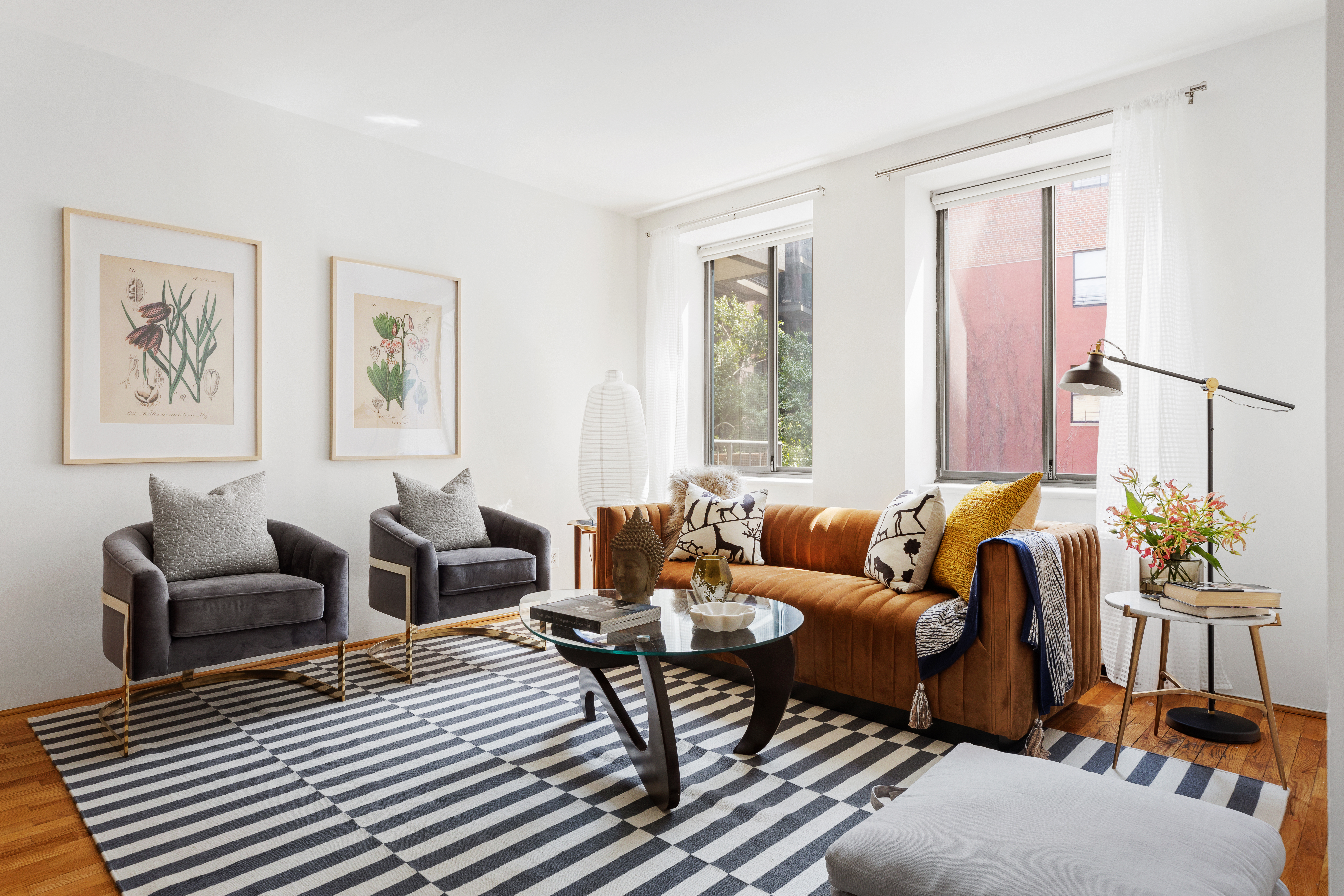 167 Perry Street, Unit 4K Manhattan, NY 10014 - Photo 3 of 11 a living room with furniture and a window