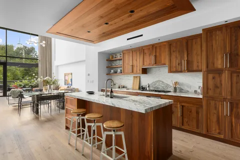 a kitchen with a sink stove and cabinets