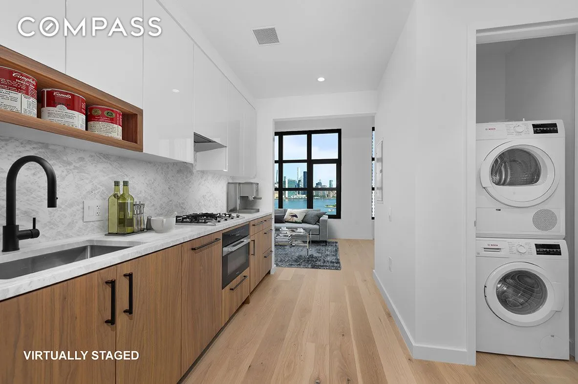 a kitchen with stainless steel appliances granite countertop a sink and cabinets