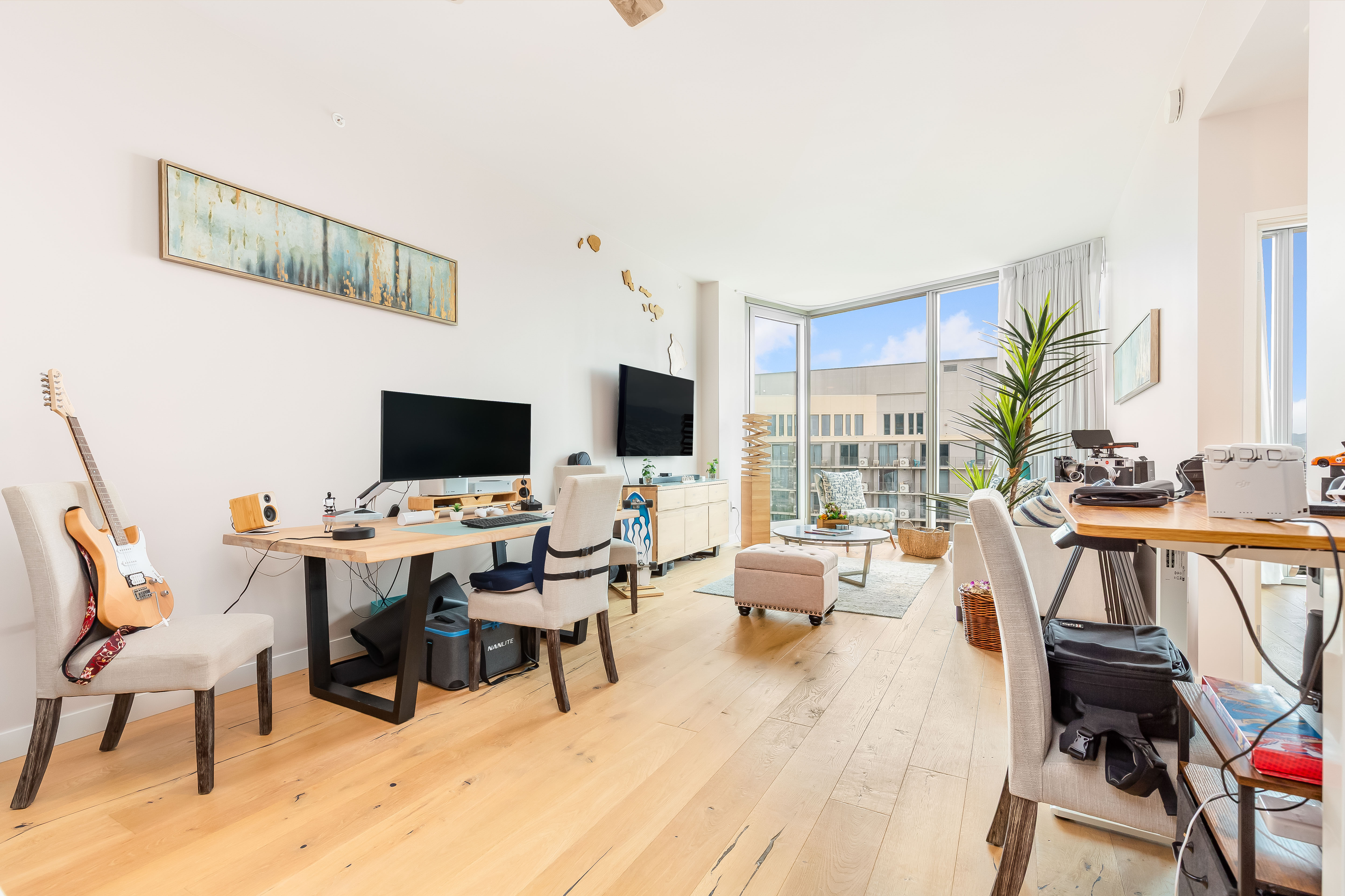 1001 Queen Street Honolulu, HI 96814 - Photo 2 of 29 a living room with furniture and a flat screen tv