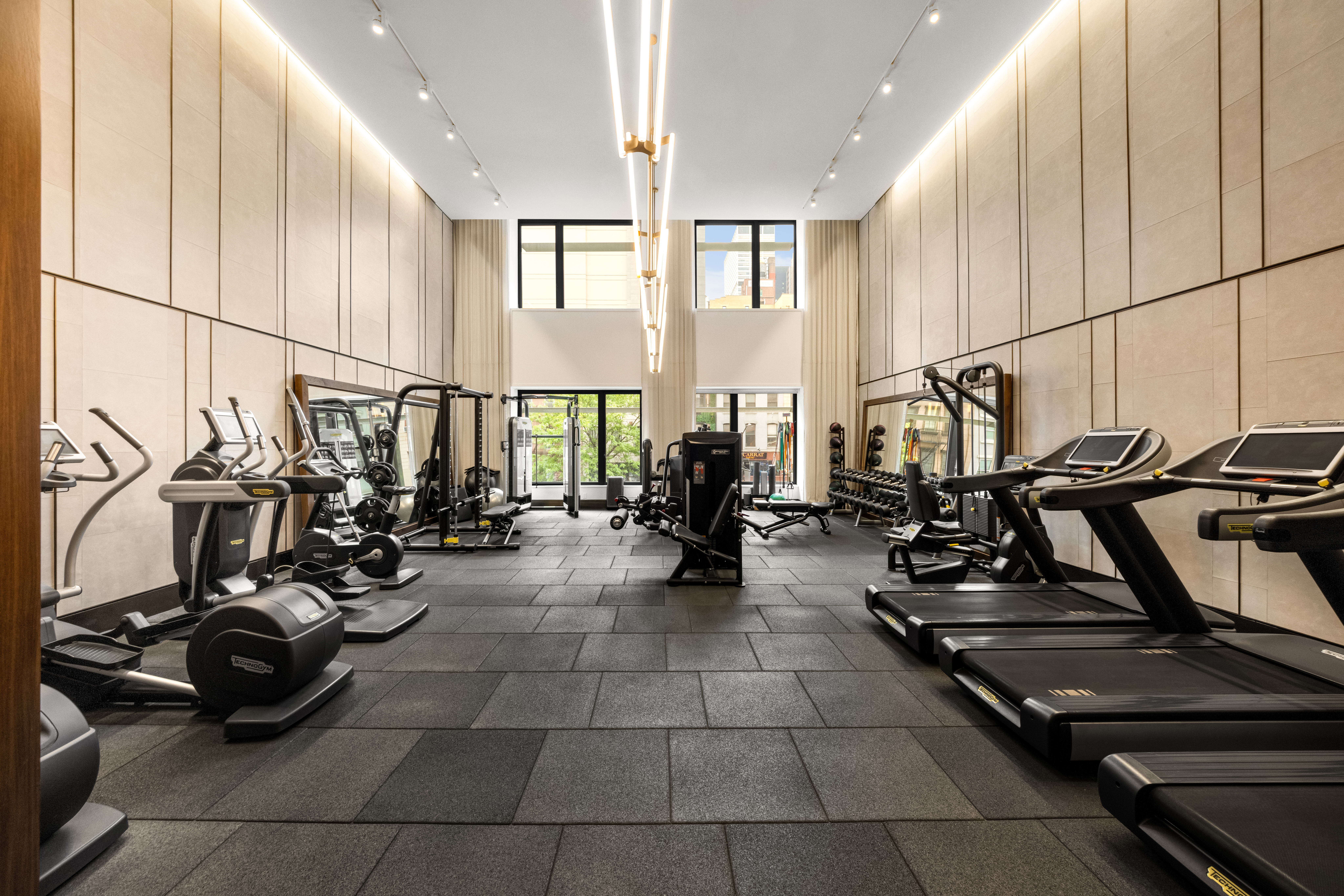 301 East 50th Street, Unit 8C Manhattan, NY 10022 - Photo 15 of 20 a view of a room with gym equipment