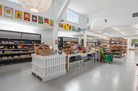 a room with lots of furniture and a baby