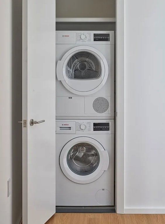5 South 5th Street, Unit 913 Brooklyn, NY 11249 - Photo 4 of 24 a utility room with dryer and washer