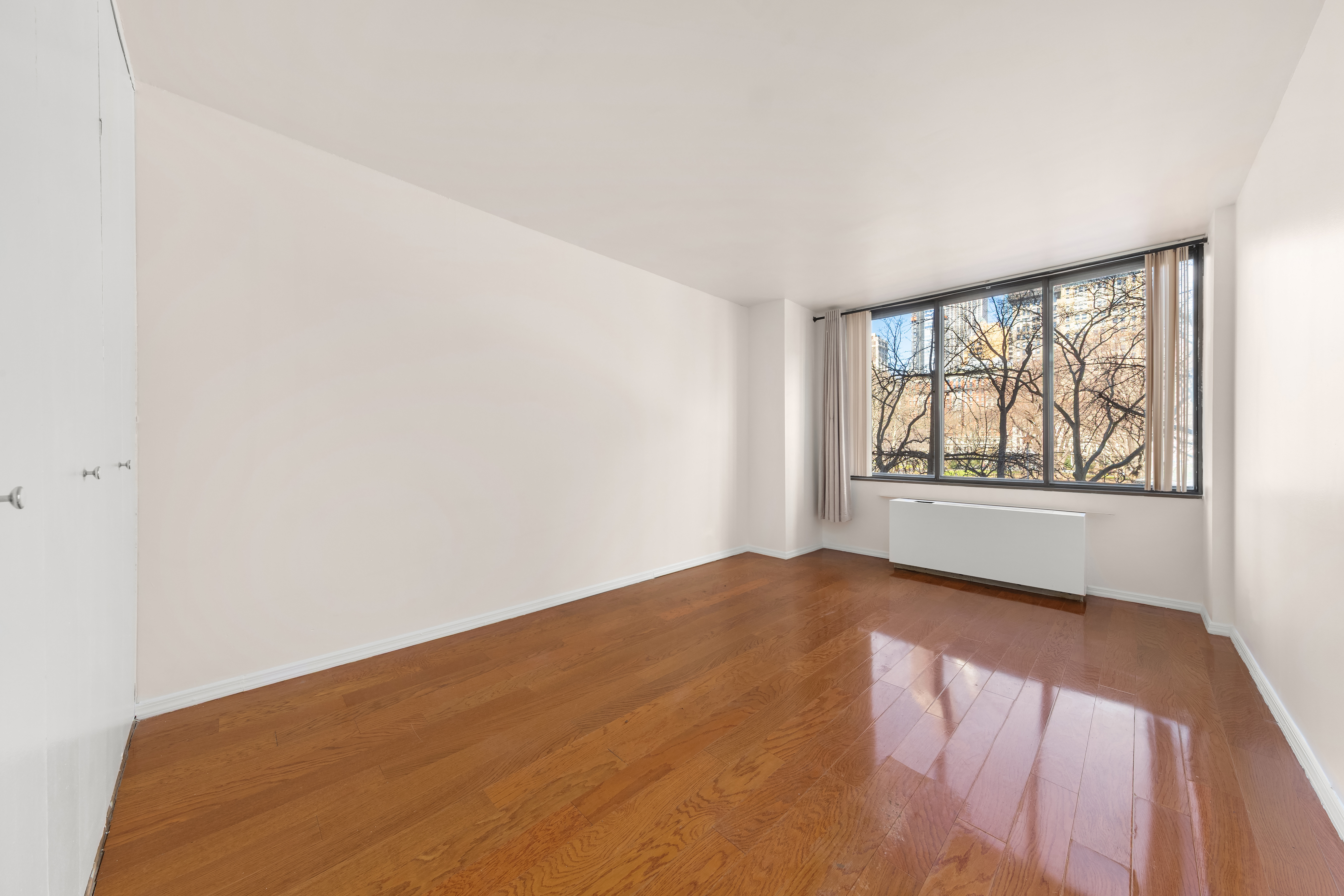 5 East 22nd Street, Unit 3N Manhattan, NY 10010 - Photo 5 of 9 an empty room with windows