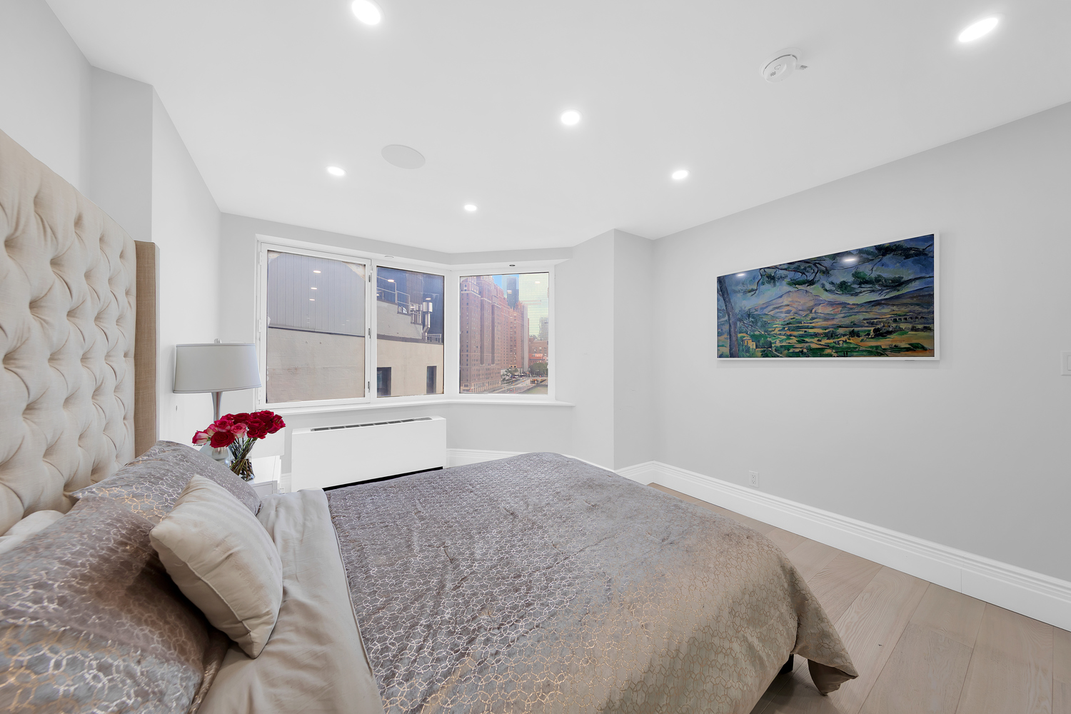 415 East 37th Street, Unit 9JK Manhattan, NY 10016 - Photo 8 of 28 a bedroom with a bed and a dresser