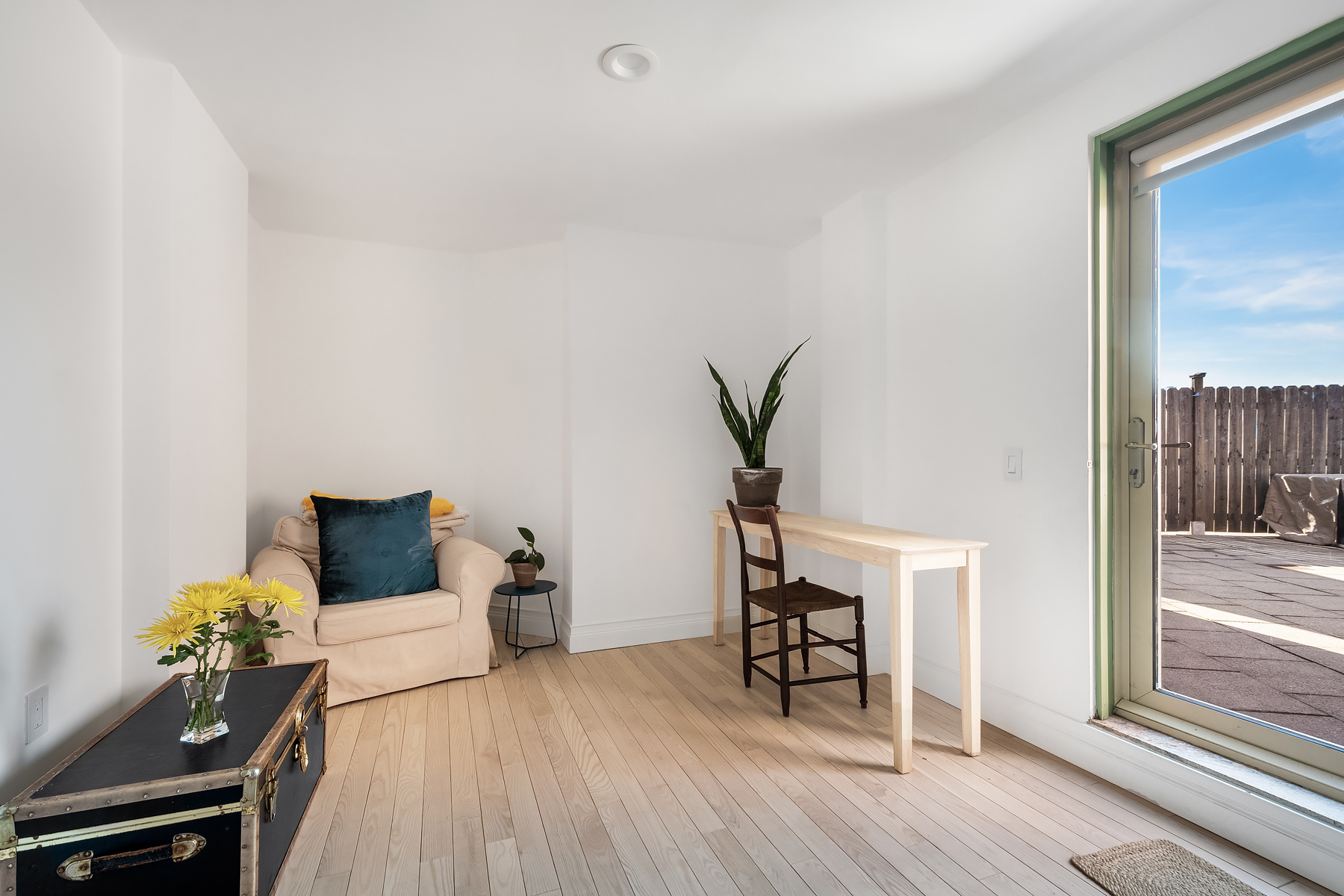 163 St Nicholas Avenue, Unit PH7A Manhattan, NY 10026 - Photo 8 of 11 a living room with furniture and a wooden floor