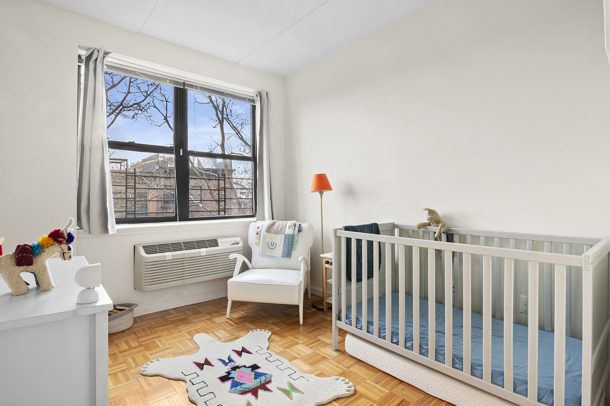129 Boerum Place, Unit 5D Brooklyn, NY 11201 - Photo 4 of 9 a living room with furniture and a large window