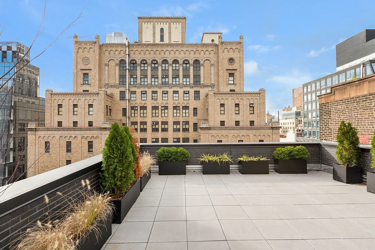 139 East 23rd Street, Unit 7 Manhattan, NY 10010 - Photo 14 of 17 a view of a building with potted plants