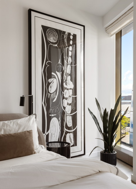 500 West 18th Street, Unit WEST 5E Manhattan, NY 10011 - Photo 11 of 15 a picture of a bedroom with a bed and a potted plant