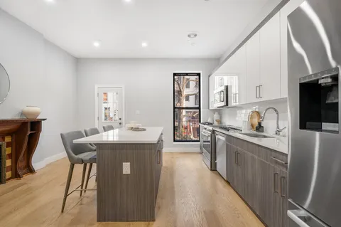 a kitchen with counter top space and appliances