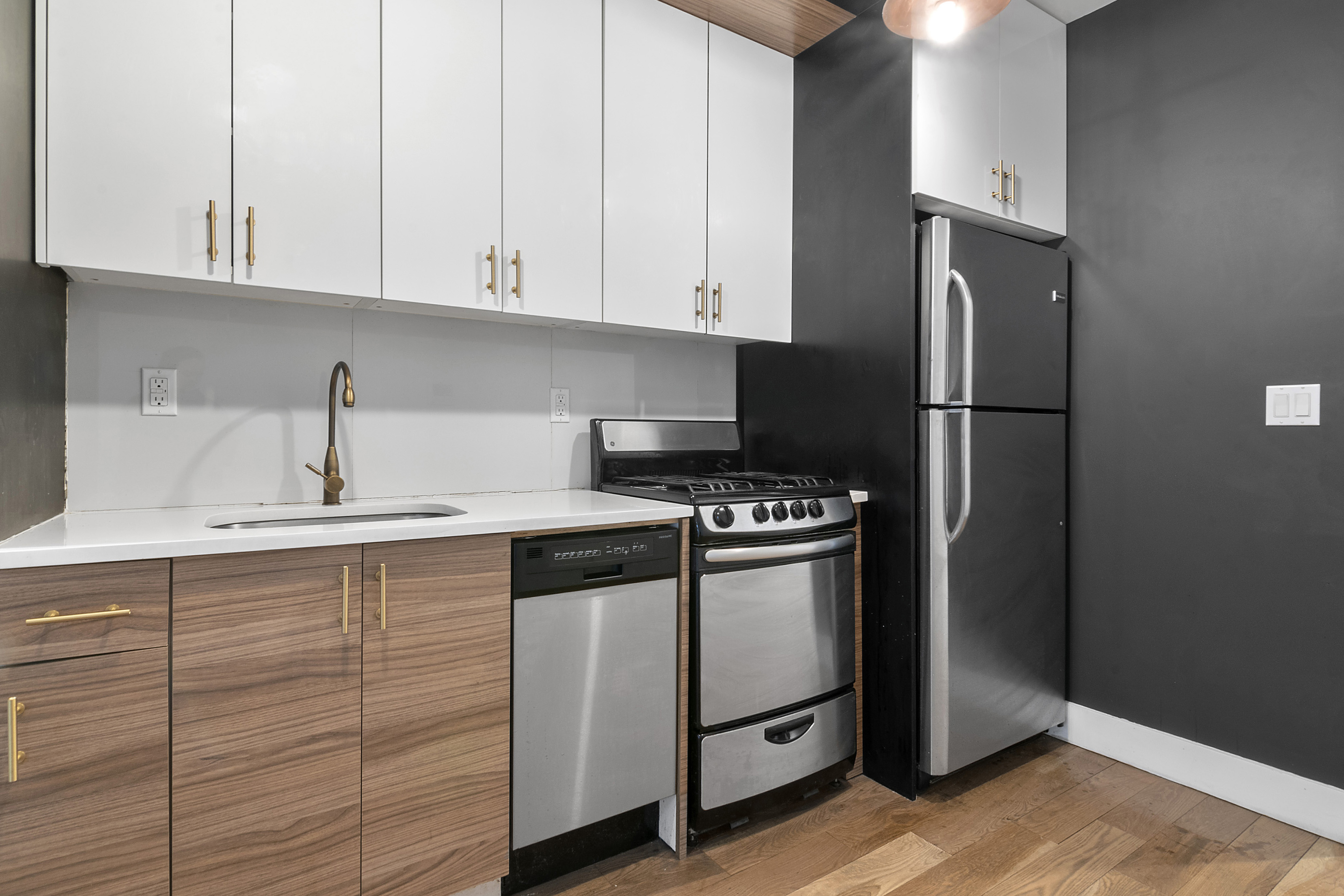 20-27 Menahan Street, Unit 1R Queens, NY 11385 - Photo 4 of 12 a kitchen with cabinets and appliances