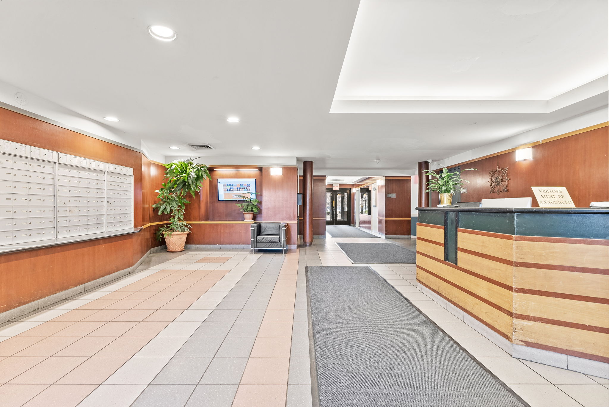 1919 Madison Avenue, Unit 214 Manhattan, NY 10035 - Photo 18 of 19 a lobby with furniture and floor to ceiling window