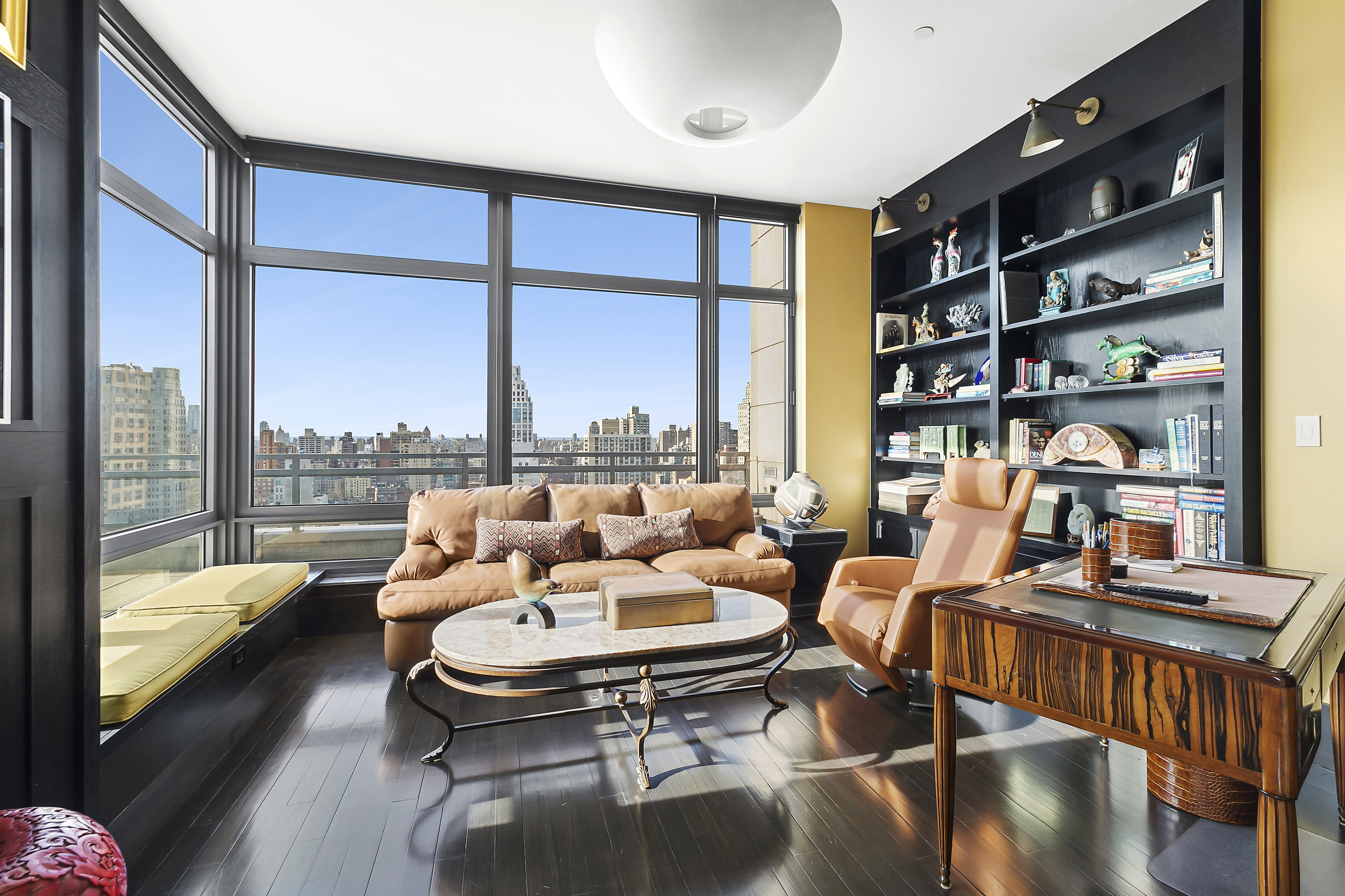 450 East 83rd Street, Unit PH1B Manhattan, NY 10028 - Photo 10 of 15 a living room with furniture water view and large window