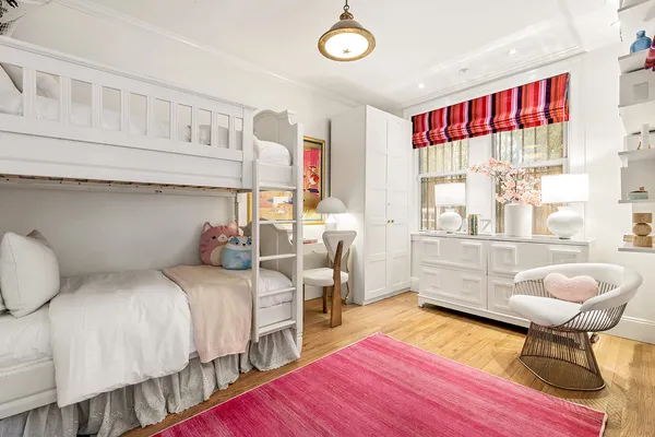 a bedroom with bed and a window
