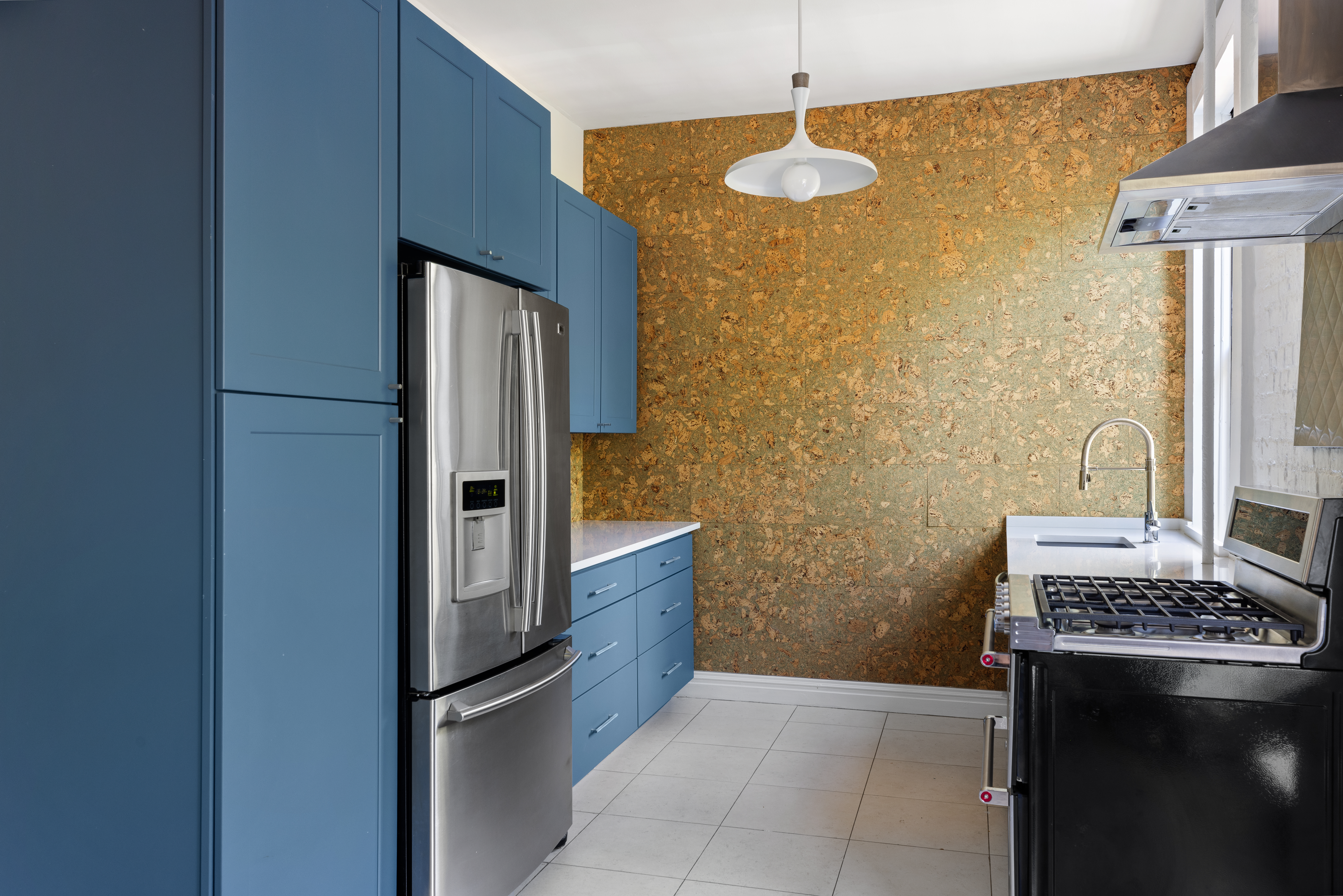 208 Warren Street Brooklyn, NY 11201 - Photo 3 of 10 a kitchen with stainless steel appliances granite countertop a refrigerator and a stove