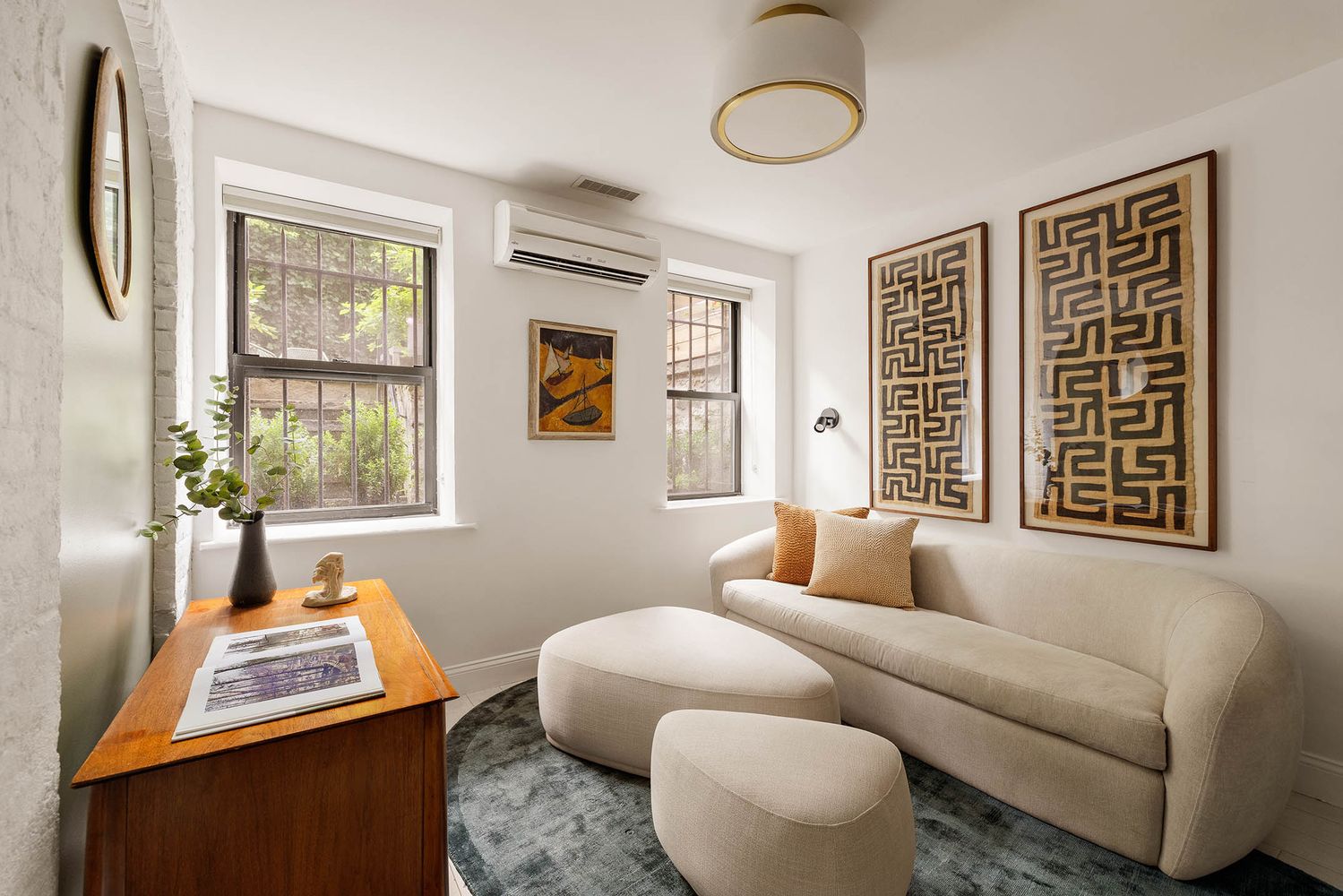 a living room with furniture and a window