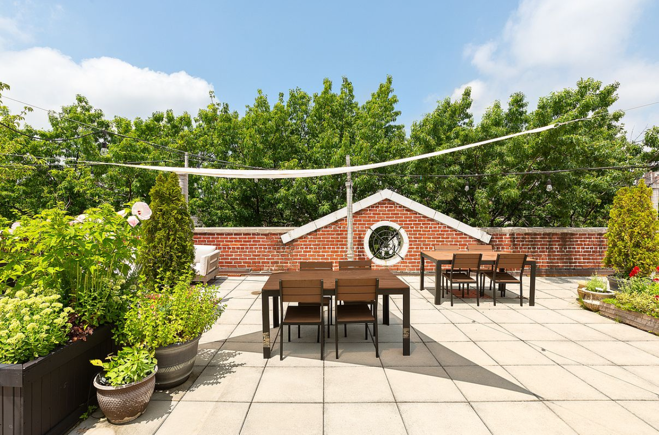 25 Minetta Lane, Unit 6G Manhattan, NY 10012 - Photo 8 of 13 a view of a chairs and table in the patio