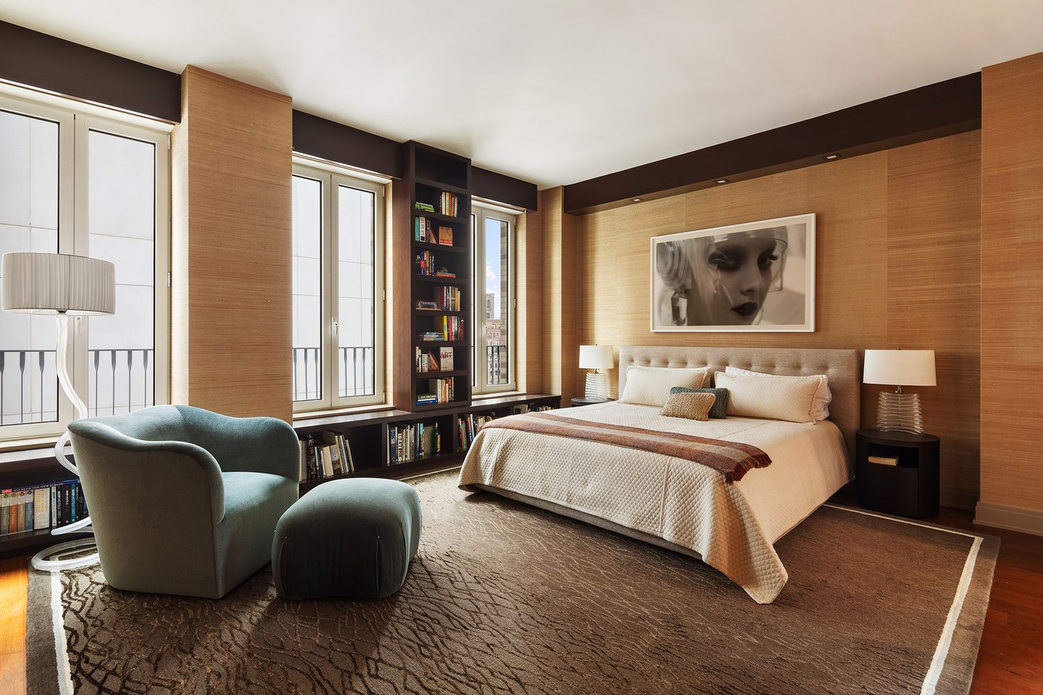 a bedroom with bed couch and window