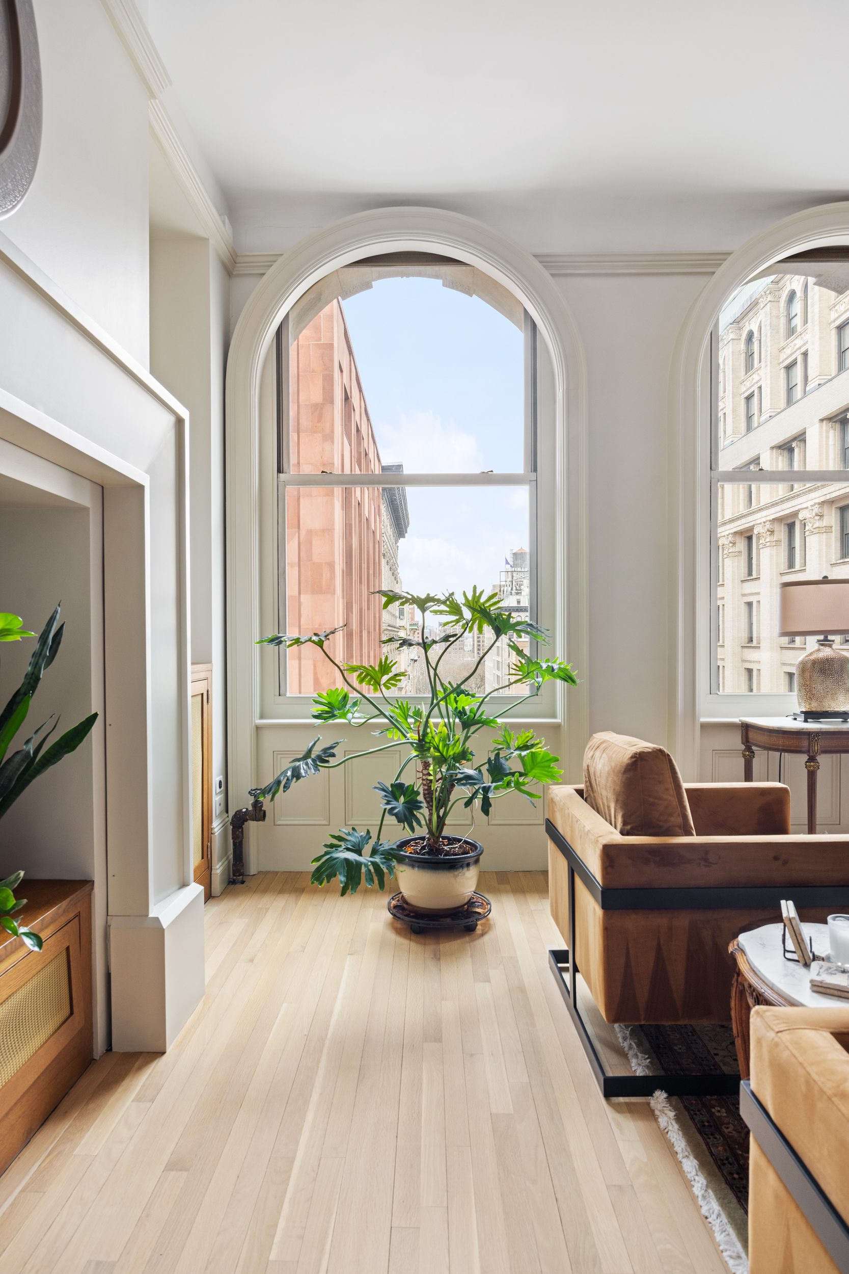 714 Broadway, Unit 8 Manhattan, NY 10003 - Photo 11 of 23 a living room with furniture fireplace and a large window