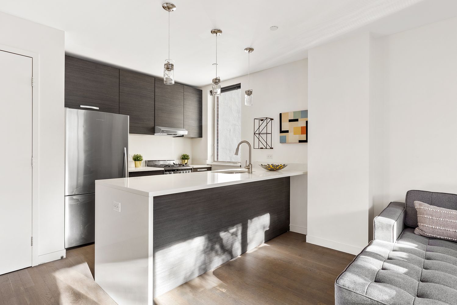 1638 8th Avenue, Unit 1B Brooklyn, NY 11215 - Photo 2 of 12 a kitchen with kitchen island a sink appliances and cabinets