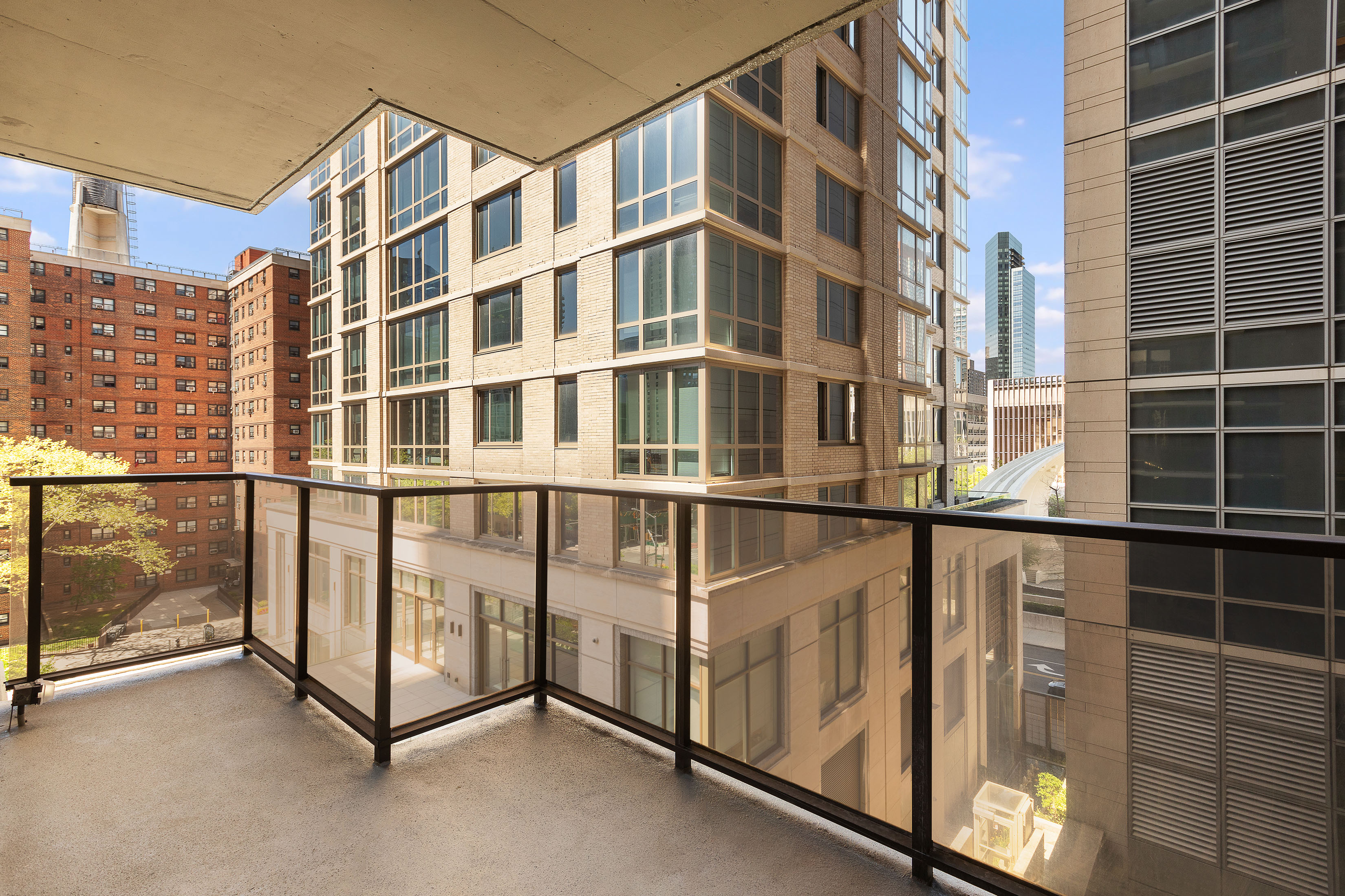 161 West 61st Street, Unit 5C Manhattan, NY 10023 - Photo 5 of 30 a view of a building from a balcony