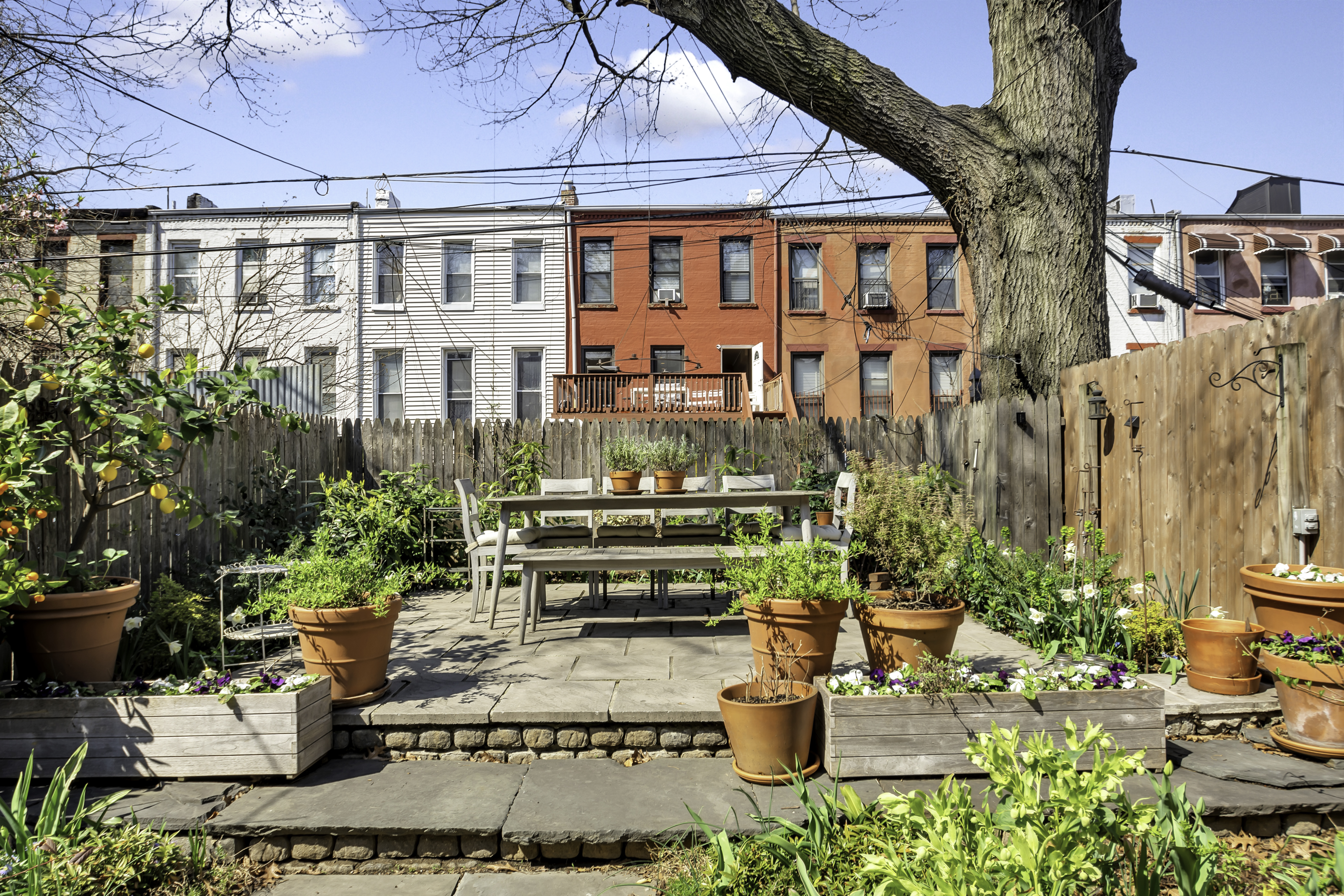 713 Greene Avenue, Unit GARDEN Brooklyn, NY 11221 - Photo 11 of 13 a view of a patio with plants and chairs