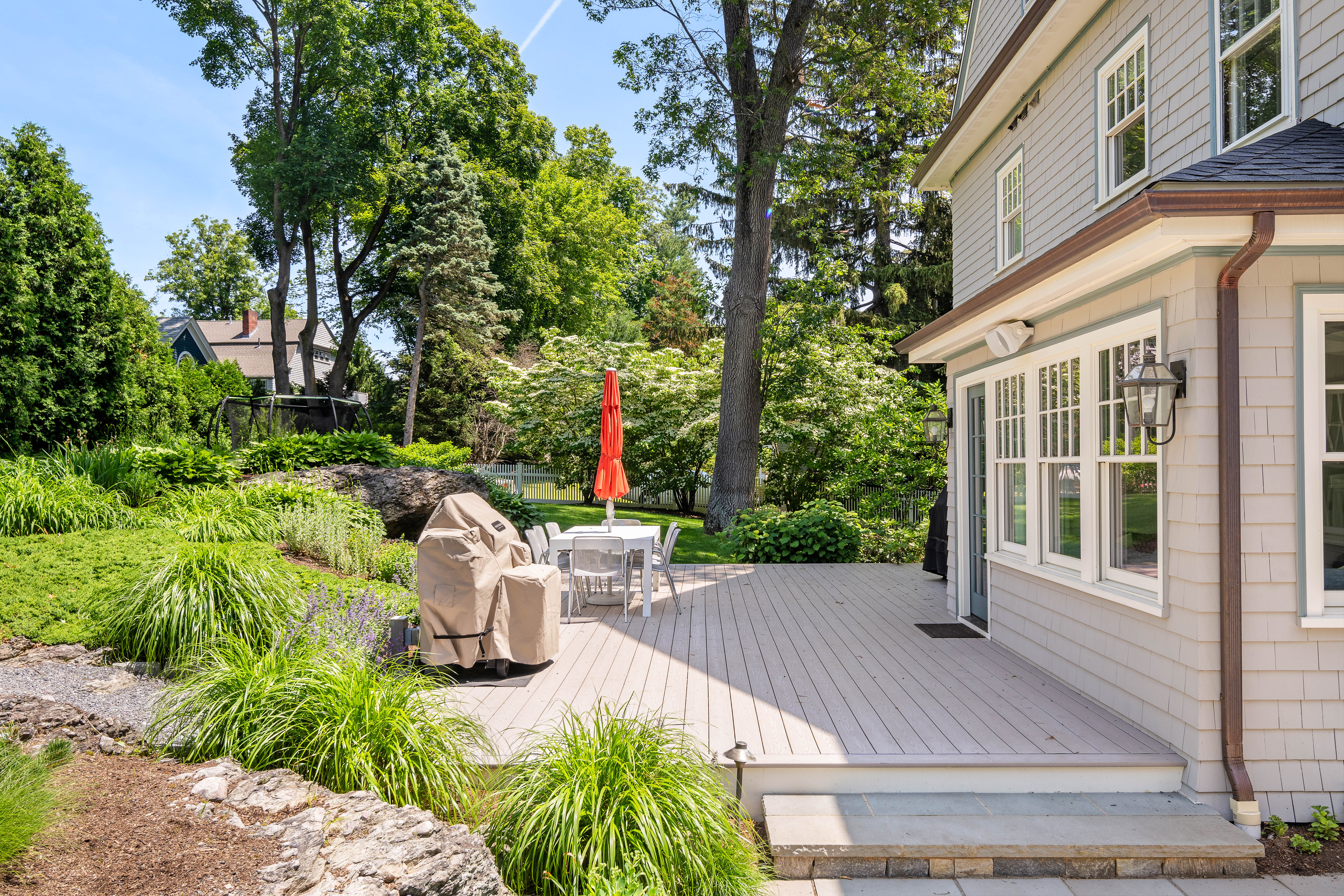 161 Pine Ridge Road Waban, MA 02468 - Photo 4 of 8 a view of house with backyard sitting area and garden
