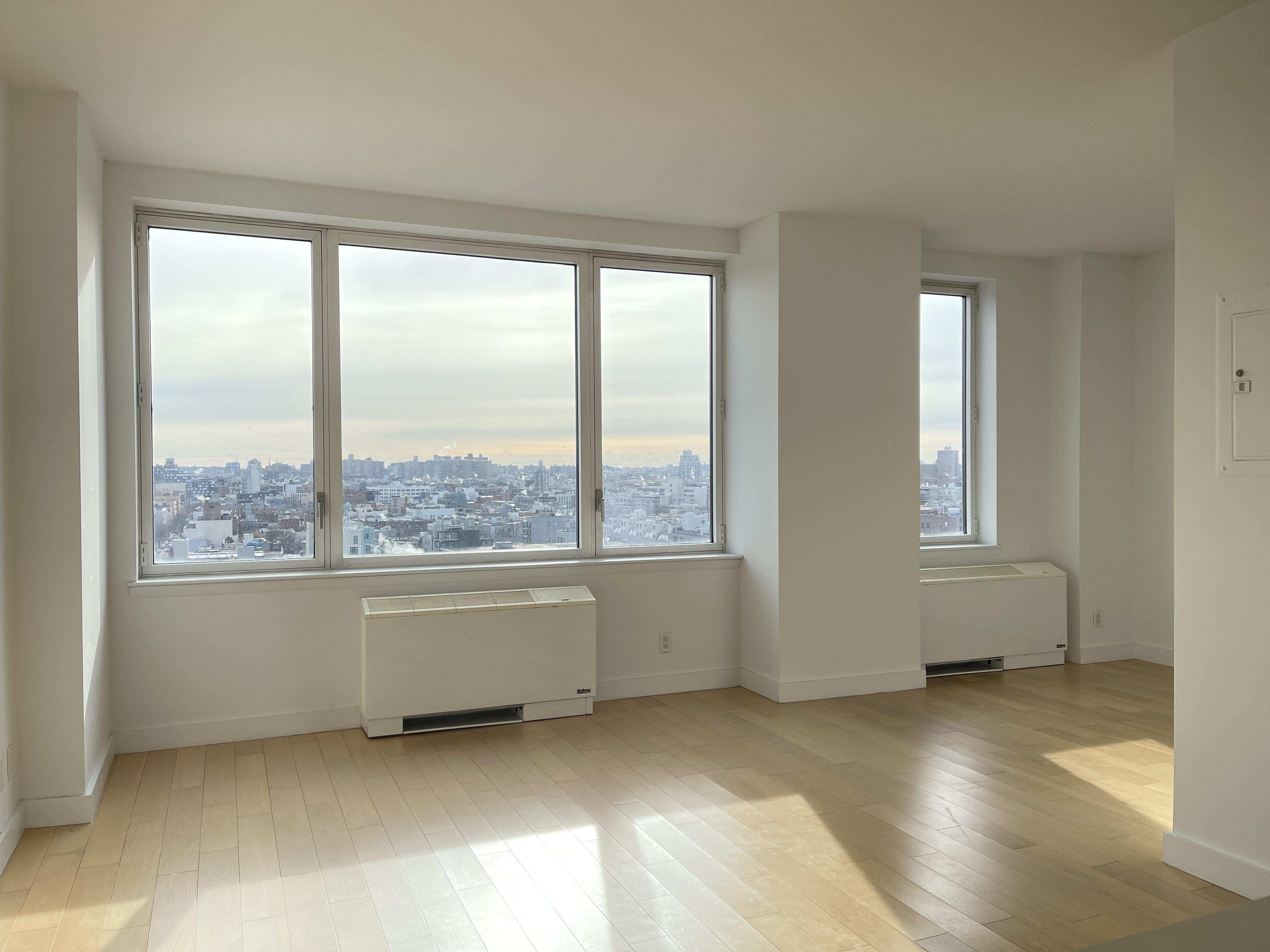 a view of an empty room with a window