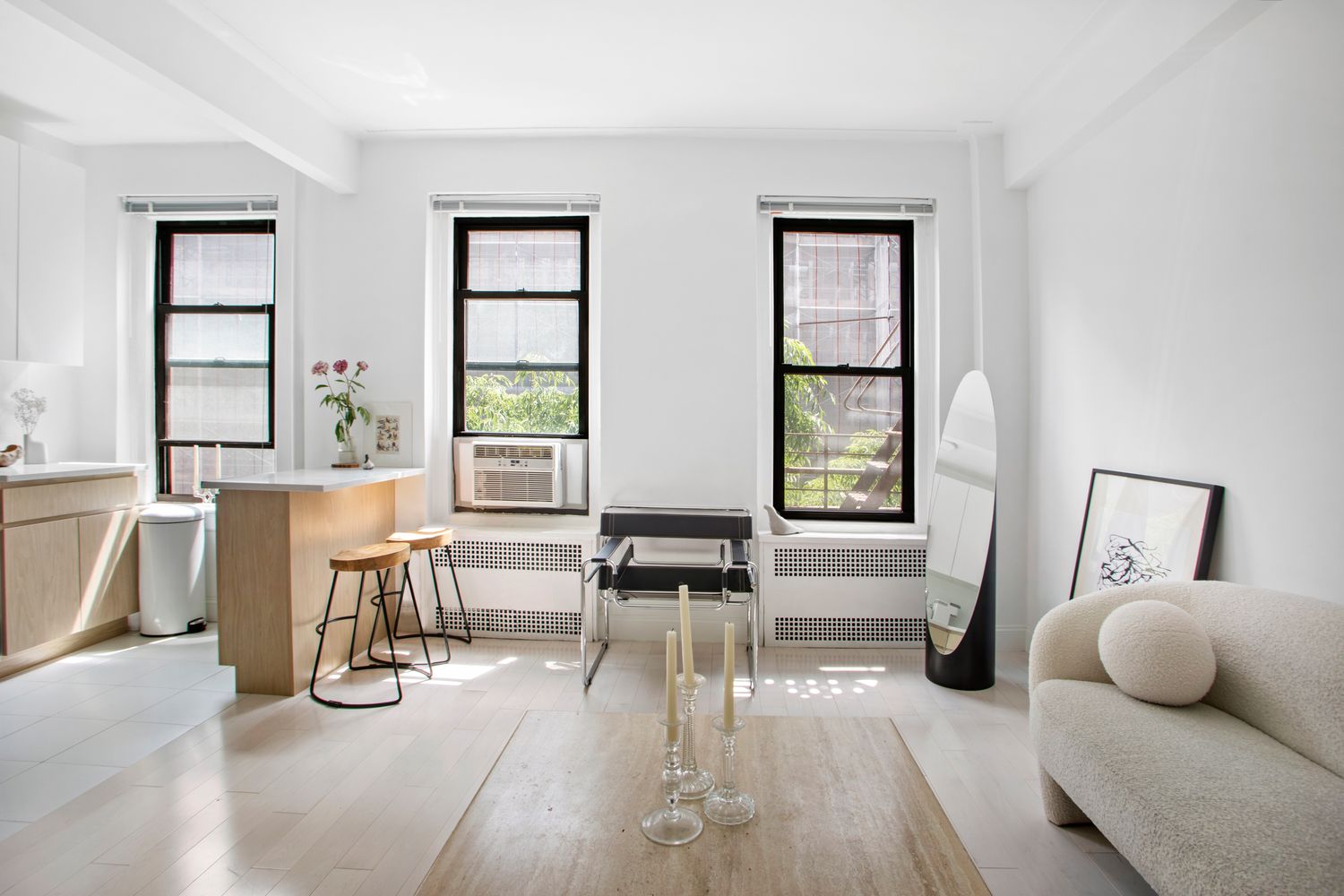 129 West 89th Street, Unit 45 Manhattan, NY 10024 - Photo 2 of 6 a living room with furniture and two large window