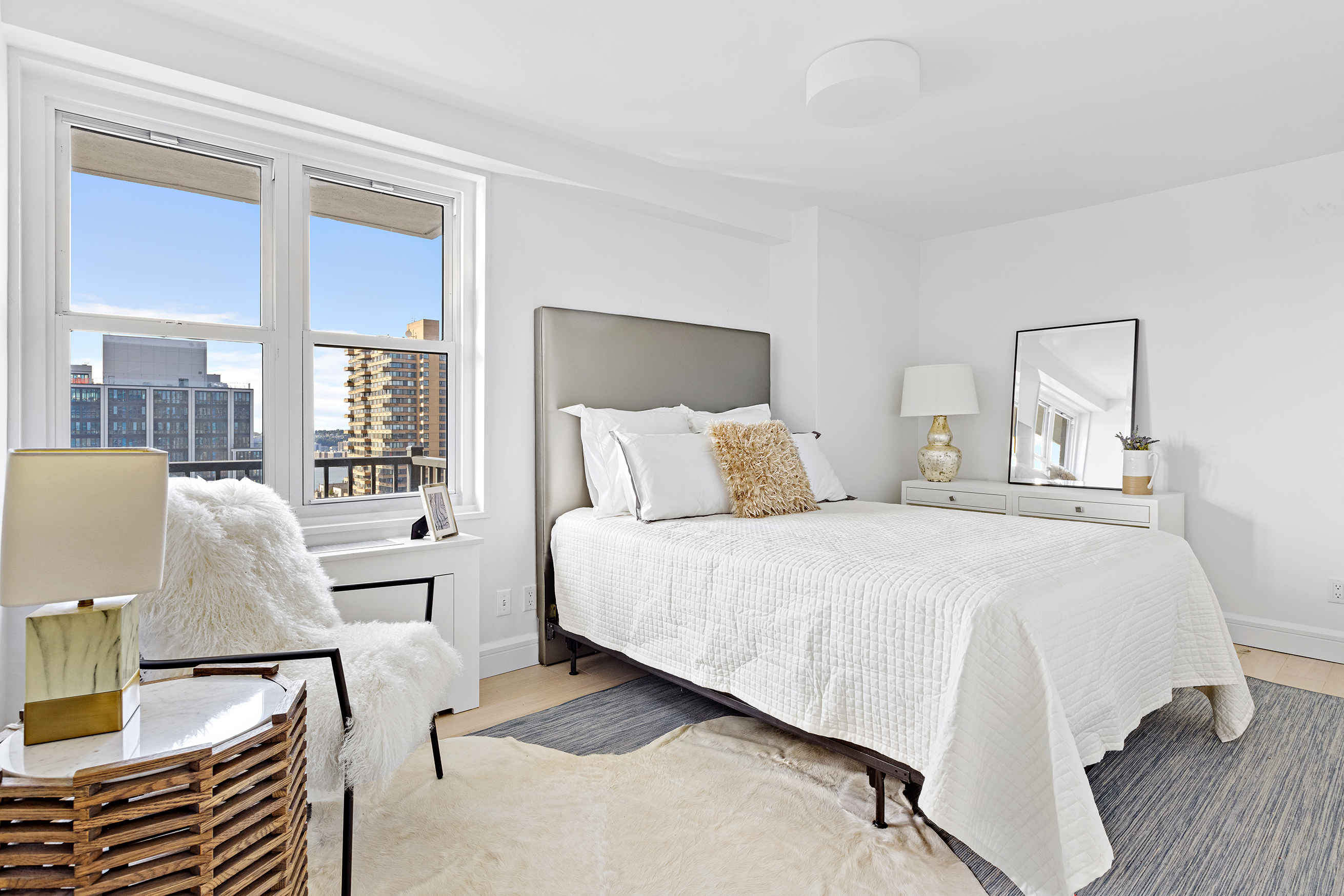 175 West 95th Street, Unit 26A Manhattan, NY 10025 - Photo 6 of 12 a bedroom with a bed and wooden floor