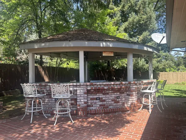 a view of a dining room with furniture wooden floor and a rug