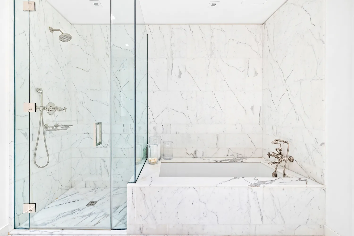 a bathroom with a bathtub and shower