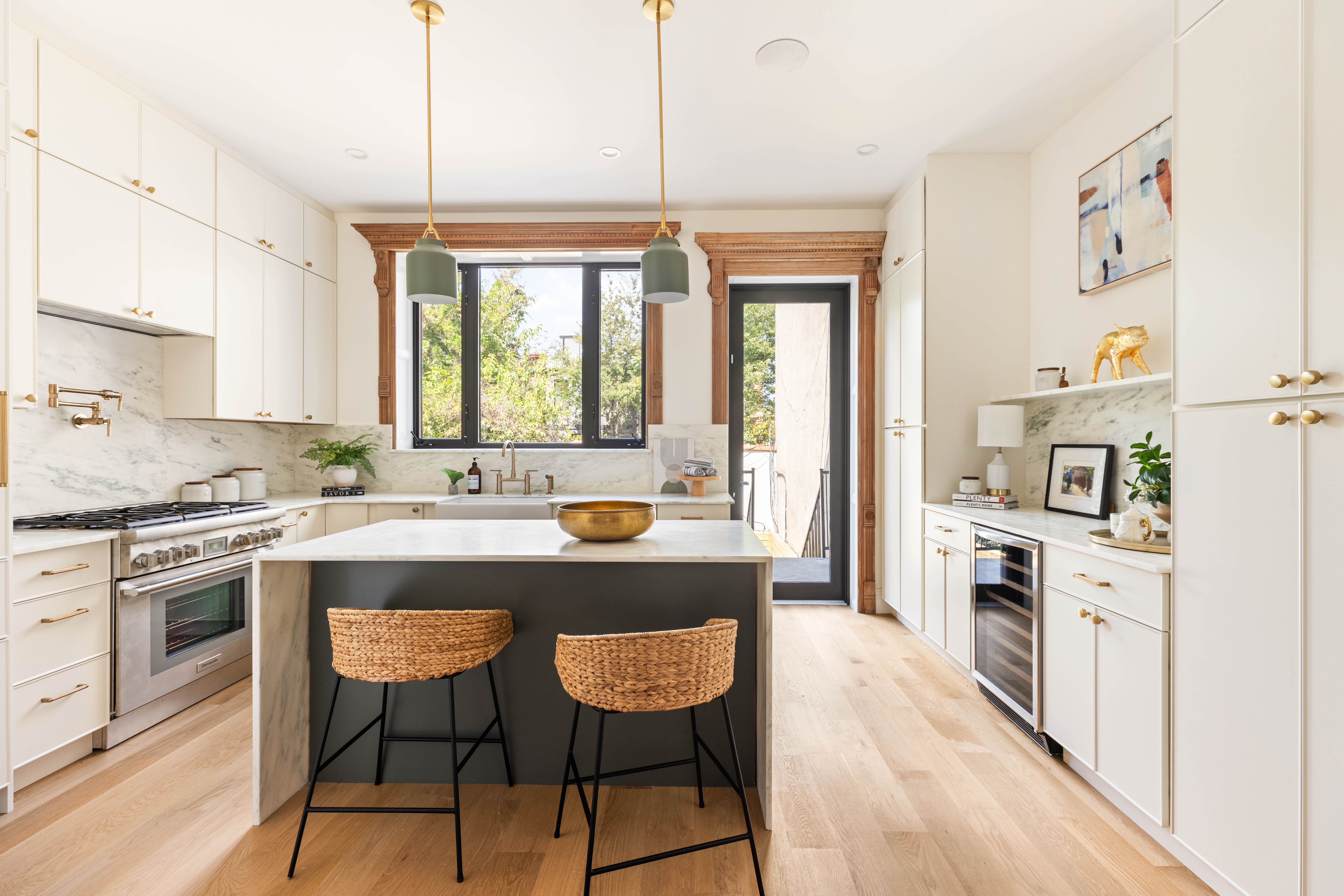 707 Macon Street Brooklyn, NY 11233 - Photo 5 of 16 a kitchen with stainless steel appliances granite countertop a stove a sink dishwasher a oven with white cabinets and wooden floor