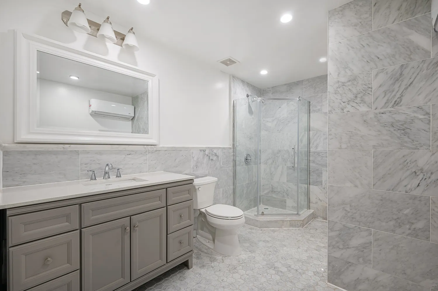 a bathroom with a bathtub shower sink and toilet