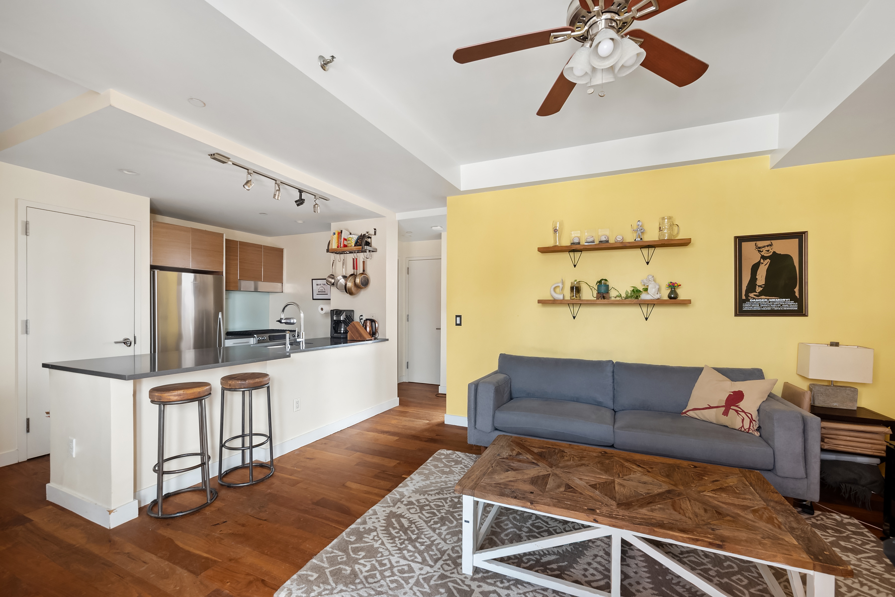 10-63 Jackson Avenue, Unit 7A Queens, NY 11101 - Photo 7 of 11 a living room with furniture and wooden floor