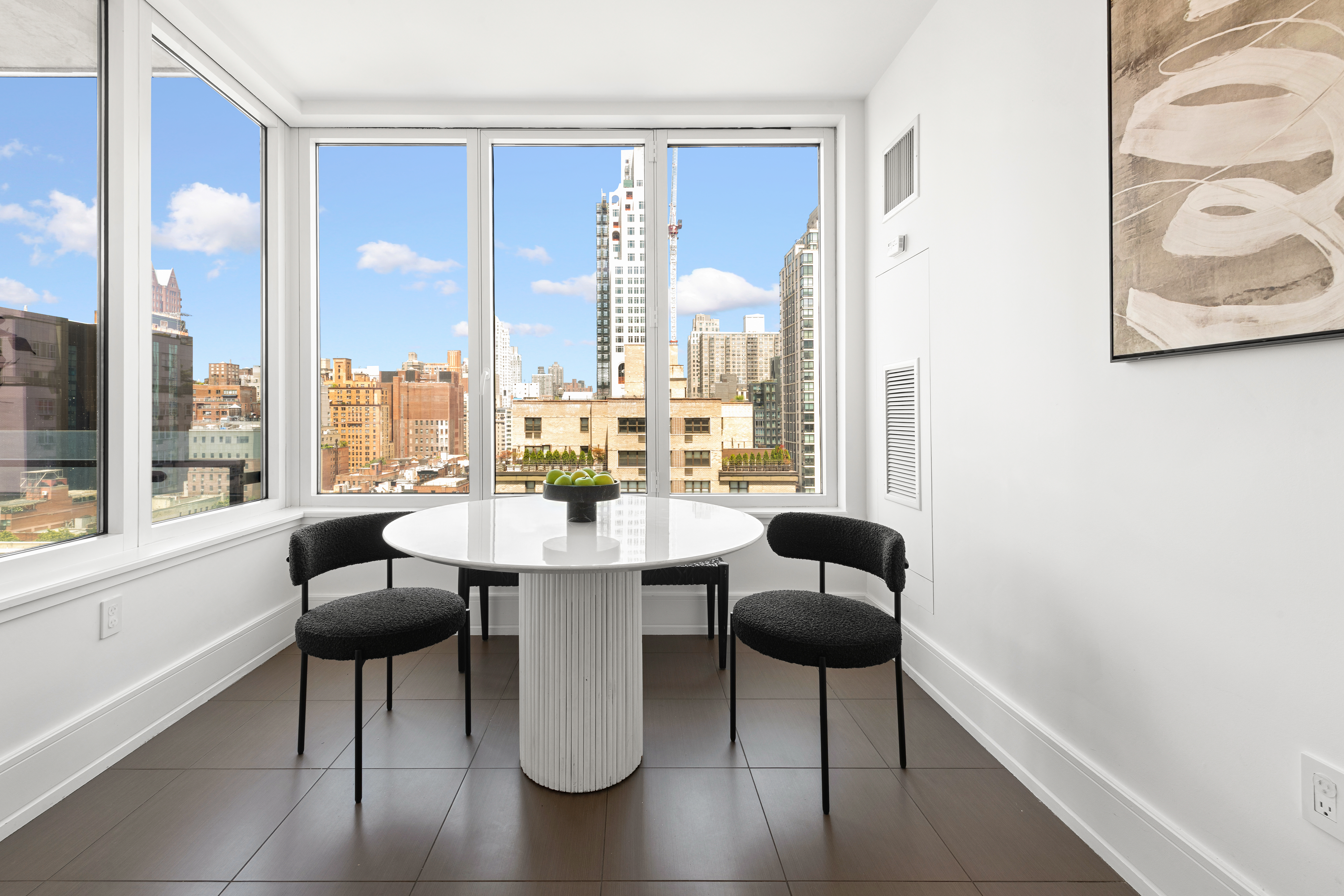 255 East 74th Street, Unit 14C Manhattan, NY 10021 - Photo 3 of 14 a dining room with furniture and a large window