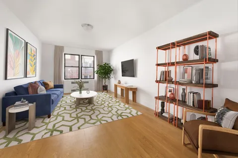 a living room with furniture fireplace and a window