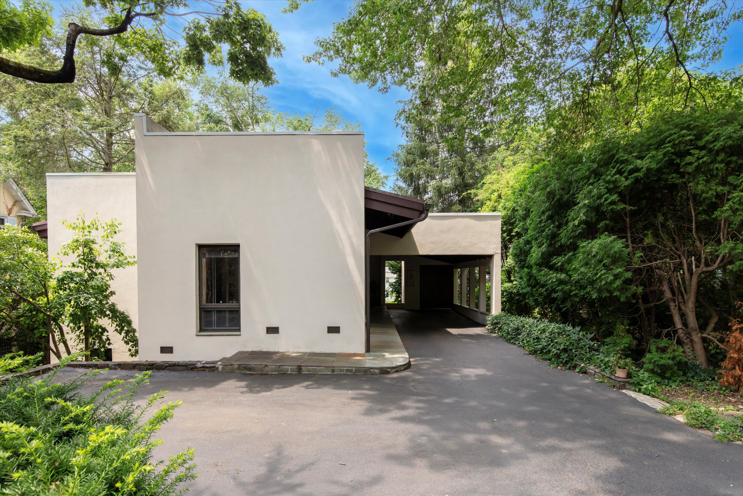 376 Merion Road Merion Station, PA 19066 - Photo 32 of 35 a view of a house with a yard and potted plants