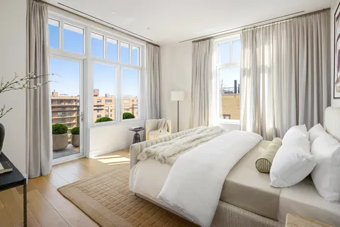 a bathroom with a bathtub double vanity sink and a shower