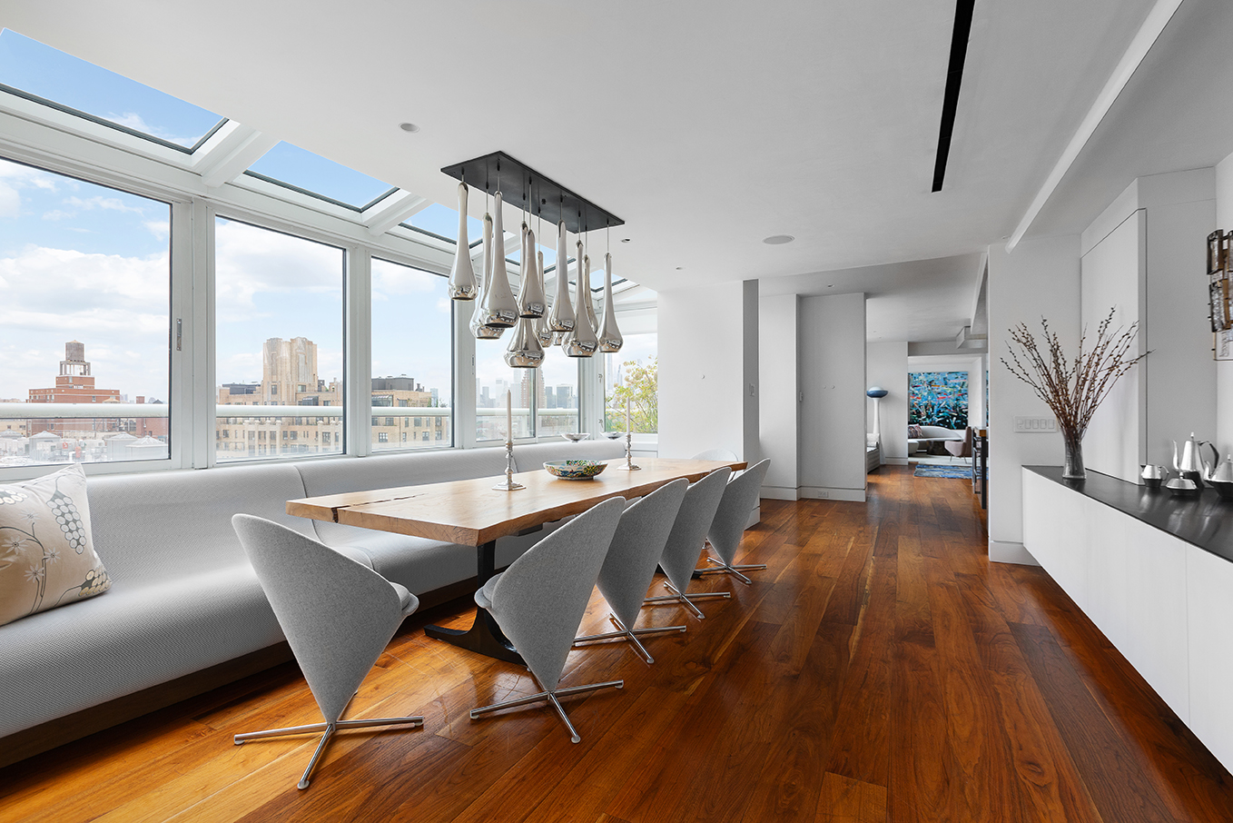 2373 Broadway, Unit PH1 Manhattan, NY 10024 - Photo 8 of 28 a dining room with wooden floor and large windows